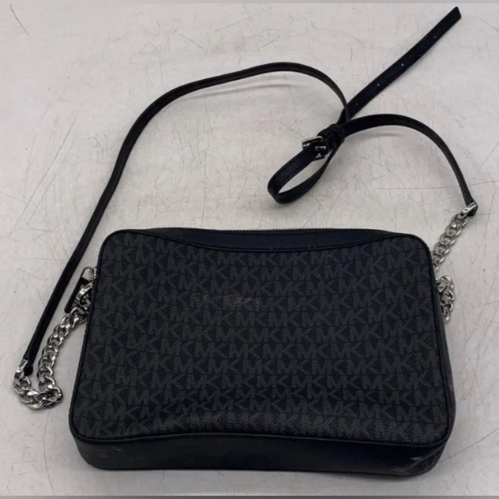 Michael Kors Black Crossbody Bag with Signature MK Design.